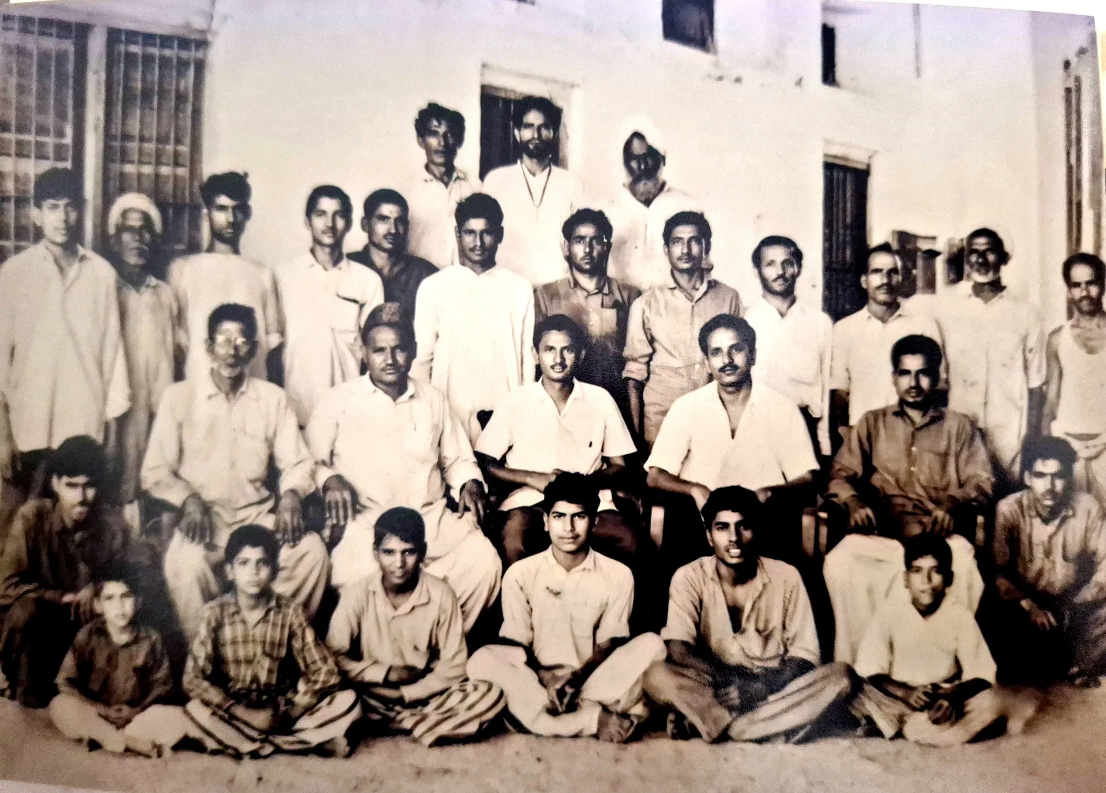 The full mill workforce — around thirty men and boys — gathered in rows for a portrait.